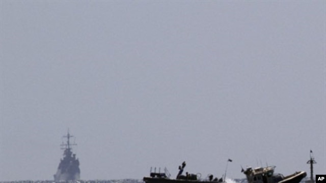 Israeli naval vessels (L) arrive at the port of Ashdod in southern Israel, 05 Jun 2010