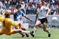 German goalkeeper Harald Schumacher, left, and defender Hans-Peter Briegel, right, stop France's William Ayache during the World Cup semifinal in Guadalajara, Mexico, on June 25, 1986.