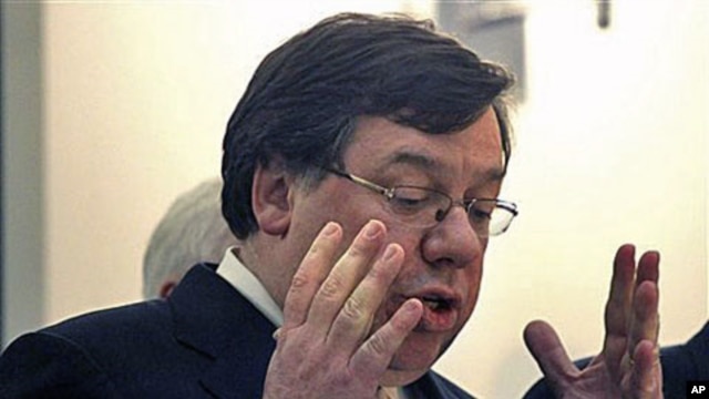 Irish Prime Minister Brian Cowen reacts during a press conference at government buildings in Dublin, Ireland, regarding a massive EU-IMF bailout, 22 Nov 2010