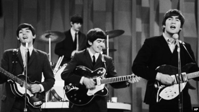 FILE - The Beatles perform on CBS' "Ed Sullivan Show" in New York, Feb. 9, 1964.