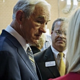 Texas Congressman Ron Paul greets supporters before he speaks at the Iowa Faith & Freedom Coalition's Presidential Forum at the Iowa State Fairgrounds in Des Moines, October 22, 2011