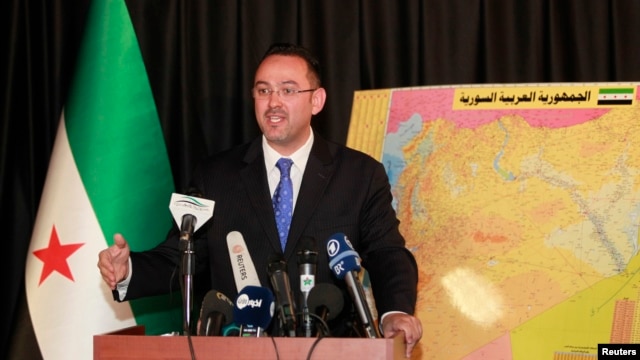FILE - Syrian National Coalition spokesman Khaled Saleh speaks during a news conference in Istanbul,September 3, 2013.