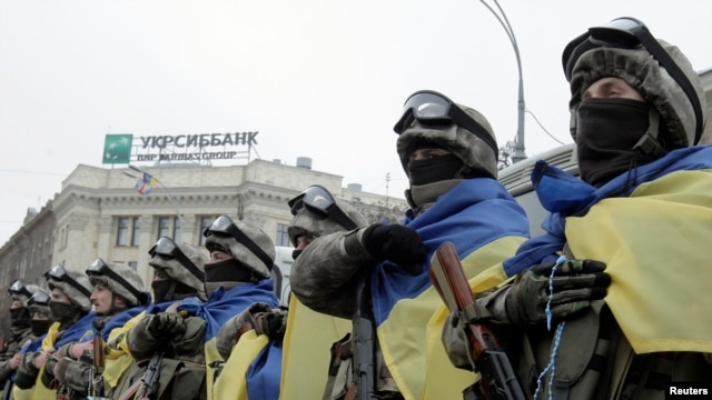 FILE - Members of a special unit of the Ukrainian armed forces line up before departing to take part in a military operation, during a farewell ceremony in Kharkiv, January 30, 2015.