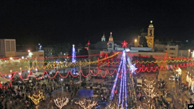 A general view shows celebrations for Christmas near the Church of the Nativity in West Bank town of Bethlehem, December 24, 2011.