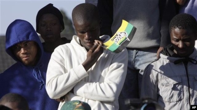 Supporters of men accused of murdering white supremacist Eugene TerreBlanche, outside Ventersdorp court, South Africa, May 22, 2012.