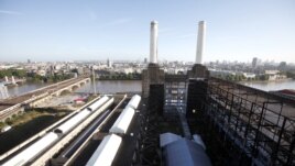 Two of the four iconic smokestacks of the former Battersea Power Station, which is to be redeveloped into retail units and housing by a Malaysian consortium, are seen in London, September 5, 2012.  