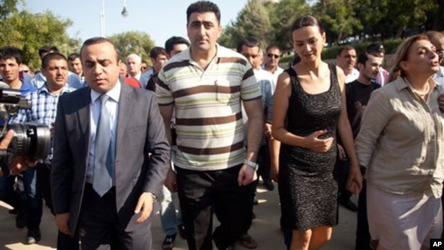 Azerbaijani military officer Ramil Safarov (C) walks in Martyrs' Alley, national memorial in the Azerbaijan's capital Baku, August 31, 2012.
