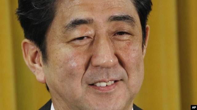 Japan's Liberal Democratic Party President Shinzo Abe smiles during a question and answer during a press conference at the party headquarters in Tokyo, December 17, 2012.
