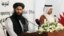Muhammad Naeem (L), a spokesman for the Office of the Taliban of Afghanistan, speaks during the opening of the Taliban Afghanistan Political Office in Doha, June 18, 2013. 
