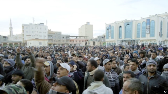 Libyan protesters take part in a demonstration in the seaport city of Tobruk, February 20, 2011