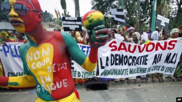 Malians living in Ivory Coast protest against a coup in their country, during the Extraordinary Meeting of ECOWAS, in Abidjan, March 27, 2012.