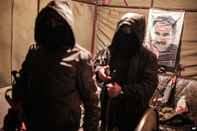 Militants of the Kurdistan Workers' Party, or PKK, stand in a bunker in Sirnak, Turkey, Dec. 23, 2015.