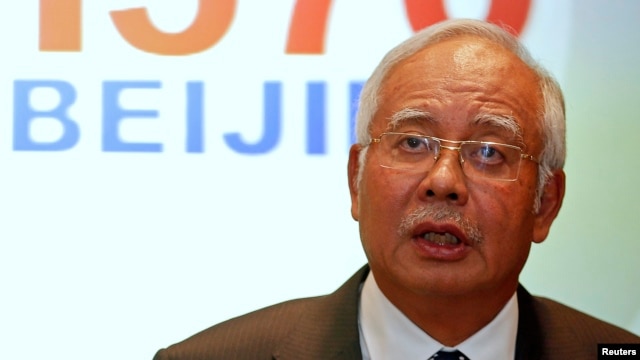 Thủ tướng Malaysia Najib Razak phát biểu trước các phóng viên về sự mất tích của chuyến bay MH370, tại sân bay quốc tế Kuala Lumpur, 15/3/2014