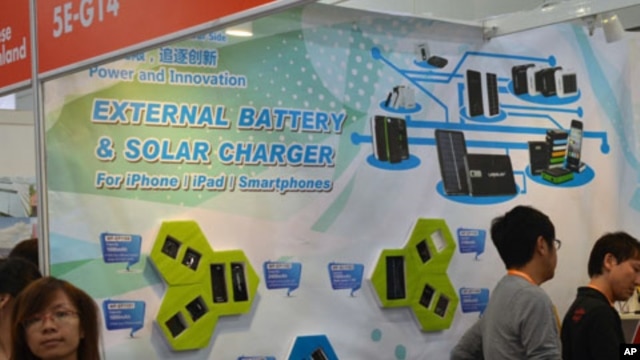 An advertisement shows solar batteries that are compatible with Apple products, like the iPhone and iPad, at the Hong Kong Electronics Fair,  October 13, 2011.