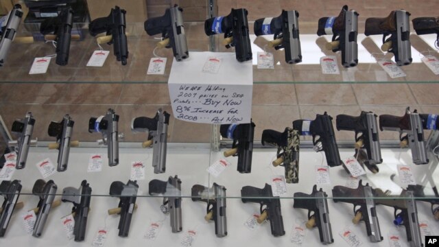 Handguns are on display at B & J Guns in Colonie, New York, June 26, 2008.  The Supreme Court ruled that Americans have a constitutional right to keep guns in their homes for self-defense.
