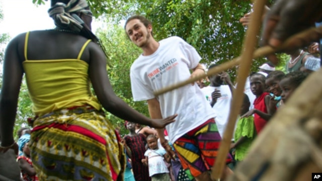 Tribe members and locals dance together at the launch of
TribeWanted, an ecotourism venture set up on John Obey beach, 80km
south of the capital, Freetown