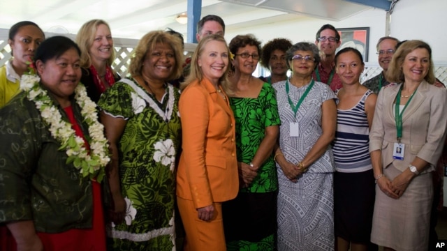 U.S. Secretary of State Hillary Rodham Clinton, center, poses with female participants of the "Dialogue on Gender Equality" in Rarotonga, Cook Islands, Aug. 31, 2012. 