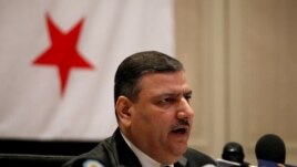 Riad Hijab, Syria’s defected former prime minister, speaks at a press conference at the Hyatt Hotel in Amman, Jordan, August 14, 2012.