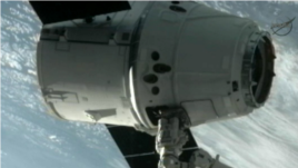 The SpaceX Dragon commercial cargo craft after it was grappled and connected to the International Space Station, May 25, 2012. (AP/NASA)