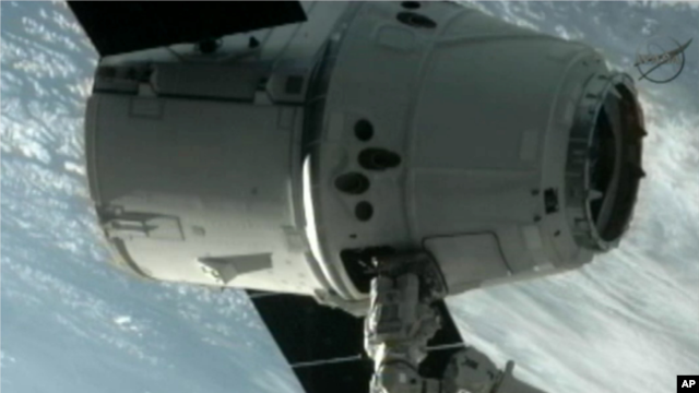 The SpaceX Dragon commercial cargo craft after it was grappled and connected to the International Space Station, May 25, 2012. (AP/NASA)