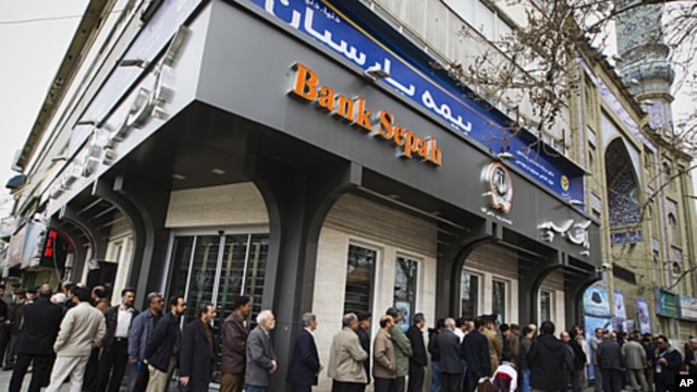 People stand in line to cast their votes at a mosque in eastern Tehran, Iran, during the parliamentary election,  March 2, 2012.
