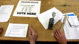 Staff wait for Irish voters to decide on the European Fiscal Treaty Referendum at a polling station in North Dublin, Ireland, May 31, 2012.
