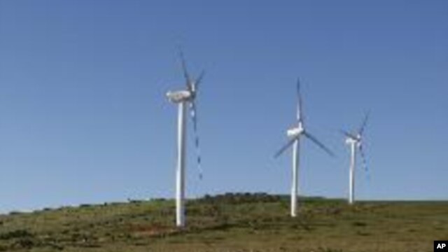 Giant wind turbines dot the landscape at the Darling Wind Power national demonstration project near Cape Town. 