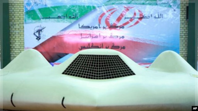 This photo released on Thursday, Dec. 8, 2011, by the Iranian Revolutionary Guards and taken at an undisclosed location claims to show the US RQ-170 Sentinel drone which Tehran says its forces downed earlier this week