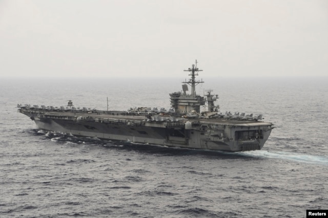 FILE - The aircraft carrier USS Theodore Roosevelt (CVN 71) transits the South China Sea in this U.S. Navy picture taken Oct. 29, 2015. U.S. Secretary of Defense Ash Carter will visit the Roosevelt as it transits the South China Sea on Thursday.