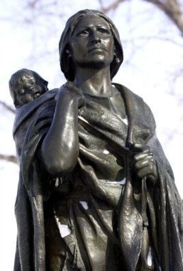 A statue of Sacagawea, an Indian translator for the Lewis and Clark expedition, is shown at the state Capitol in Bismark, North Dakota. (AP Photo/Will Kincaid)