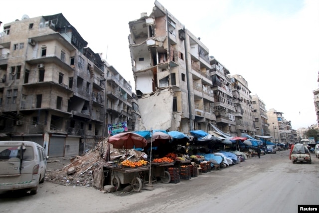 Stalls are seen on a street beside damaged buildings in the rebel held al-Shaar neighborhood of Aleppo, Syria, Feb. 10, 2016.