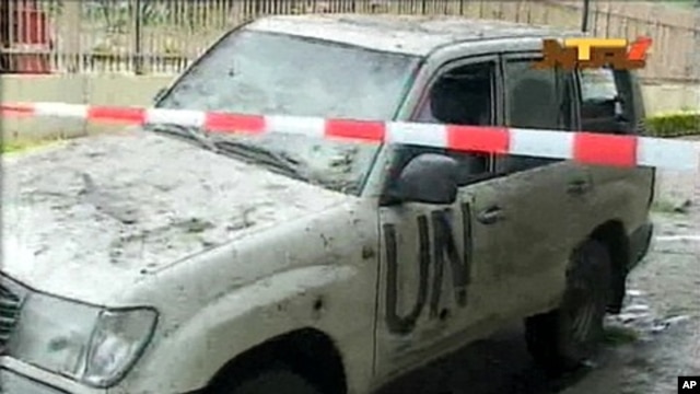A damaged U.N. vehicle after a bomb blast at the United Nations offices in the Nigerian capital of Abuja August 26, 2011.