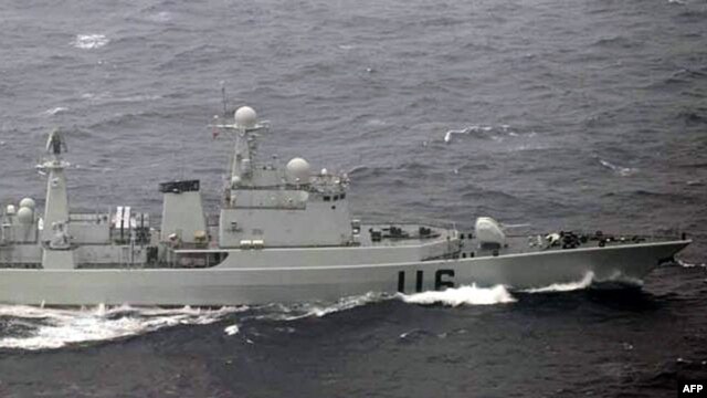 This handout picture taken by the Japanese Defense Ministry on October 16, 2012 shows a Chinese warship ship cruising in waters between two Japanese islands in Okinawa prefecture, in the East China Sea. 