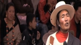 Runggye Adak speaking on stage before his arrest  (ICT Photo)