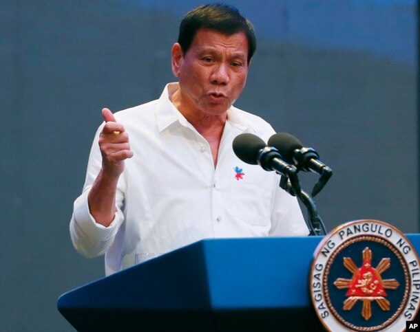 Philippine President Rodrigo Duterte gestures during his address to a Filipino business sector in suburban Pasay city south of Manila, Philippines, Oct. 13, 2016.