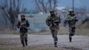 Indian army soldiers arrive at the site of a gun battle, on the outskirts of Srinagar, Indian-controlled Kashmir, Feb. 20, 2016.