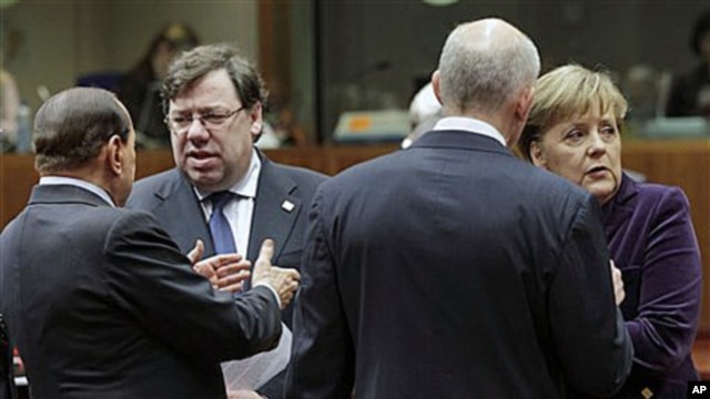 From left to right, Italy's Prime Minister Silvio Berlusconi, Irish Prime Minister Brian Cowen, Greek Prime Minister George Papandreou and German Chancellor Angela Merkel share a word during an EU summit in Brussels, Dec 16, 2010