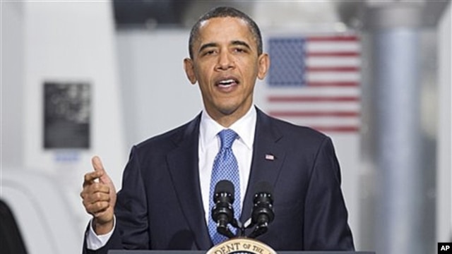 President Barack Obama gestures while speaking at a UPS facility in Landover, Maryland, April 1, 2011