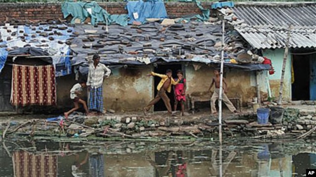 Children play at a slum in Allahabad, India, Oct. 3, 2011.