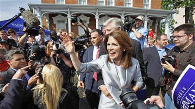 Representative Michele Bachmann, Republican from Minnesota, waves to supporters after making her formal announcement to seek the 2012 Republican presidential nomination in Waterloo, Iowa, June 27, 2011