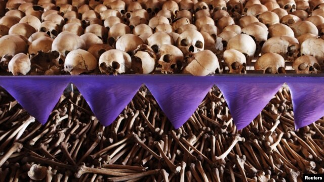 The skulls and bones of Rwandan victims rest on shelves at a genocide memorial inside the church at Ntarama just outside the capital Kigali, August 6, 2010.