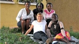 Anne Heyman with some of the youth village residents. Credit: ASYV