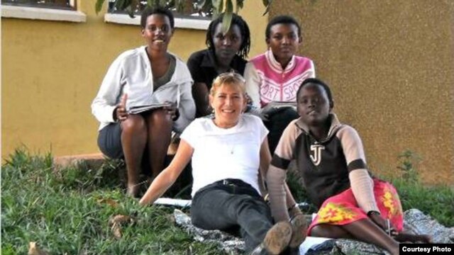 Anne Heyman with some of the youth village residents. Credit: ASYV