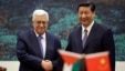China's President Xi Jinping, right, shakes hands with his Palestinian counterpart Mahmoud Abbas during a signing ceremony at the Great Hall of the People in Beijing, China, May 6, 2013.