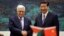China's President Xi Jinping, right, shakes hands with his Palestinian counterpart Mahmoud Abbas during a signing ceremony at the Great Hall of the People in Beijing, China, May 6, 2013.