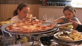 Young diners enjoy a meal at the Primo Family Restaurant in Alexandria, Virginia