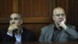 Sayed Mansour Mousavi (L) and Ahmad Abolfathi Mohammed listen to court preceeding before being sentenced to life in prison on terror-related charges, during their trial in Nairobi, May 6, 2013.
