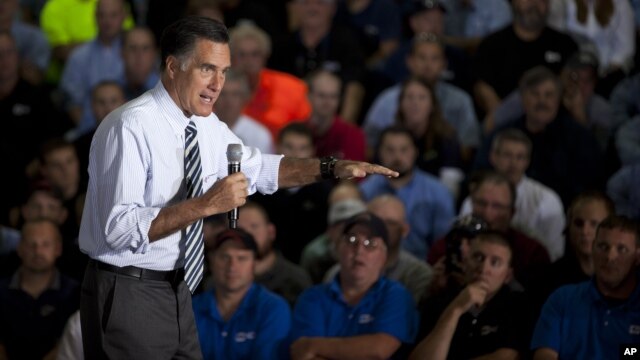Republican presidential candidate, former Massachusetts Gov. Mitt Romney gestures during a town hall meeting at Ariel Corporation in Mt. Vernon, Ohio, October 10, 2012.