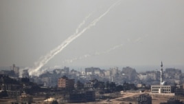 Trails of smoke are seen after the launch of rockets from the northern Gaza strip towards Israel (file photo).