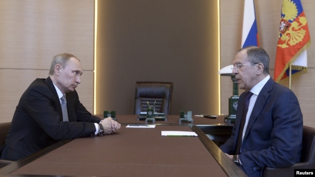 Russian President Vladimir Putin (left) meets with Foreign Minister Sergei Lavrov in Sochi, March 10, 2014.